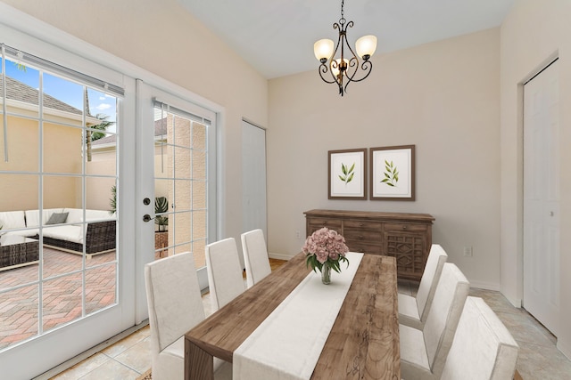 128 W Thatch Palm Cir, Jupiter, FL 33458 - dining space featuring a chandelier and light tile patterned flooring