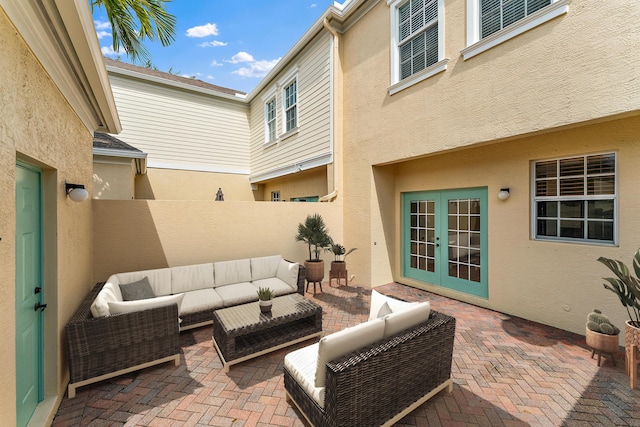 128 W Thatch Palm Cir, Jupiter, FL 33458 - fenced backyard featuring french doors, a patio area, and outdoor lounge area