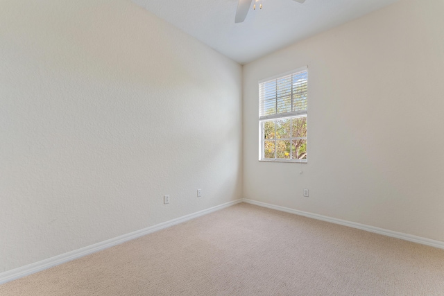 128 W Thatch Palm Cir, Jupiter, FL 33458 - empty room with a ceiling fan, light carpet, and baseboards