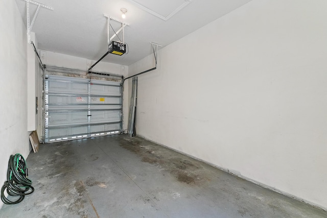 128 W Thatch Palm Cir, Jupiter, FL 33458 - garage featuring a garage door opener