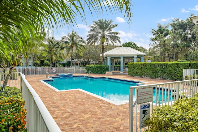 128 W Thatch Palm Cir, Jupiter, FL 33458 - community pool with a gazebo and a patio area
