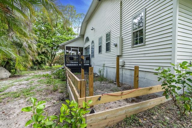 17069 81st Ln N, Loxahatchee, FL 33470 - view of side of home featuring a sunroom