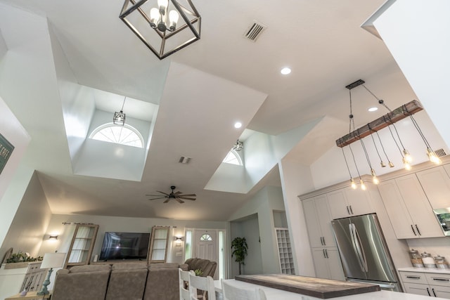 17069 81st Ln N, Loxahatchee, FL 33470 - living area with high vaulted ceiling, a chandelier, and recessed lighting
