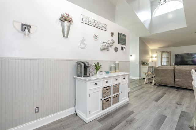 17069 81st Ln N, Loxahatchee, FL 33470 - living area with light wood-type flooring, a wainscoted wall, and baseboards
