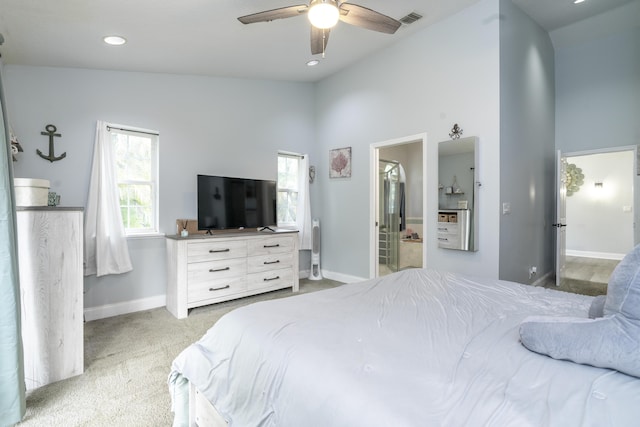 17069 81st Ln N, Loxahatchee, FL 33470 - bedroom with baseboards, light carpet, recessed lighting, ensuite bath, and high vaulted ceiling