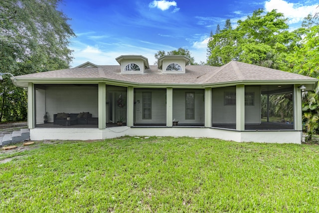 17069 81st Ln N, Loxahatchee, FL 33470 - rear view of house featuring a sunroom, a shingled roof, and a yard