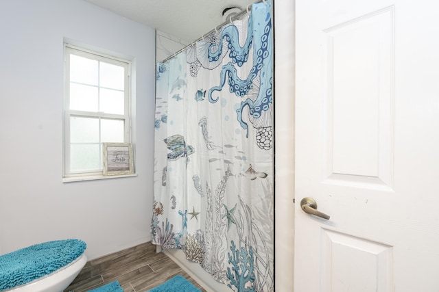 17069 81st Ln N, Loxahatchee, FL 33470 - bathroom featuring wood finished floors, toilet, and shower / bath combo