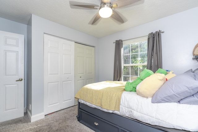 17069 81st Ln N, Loxahatchee, FL 33470 - bedroom with a closet, light carpet, a ceiling fan, and baseboards