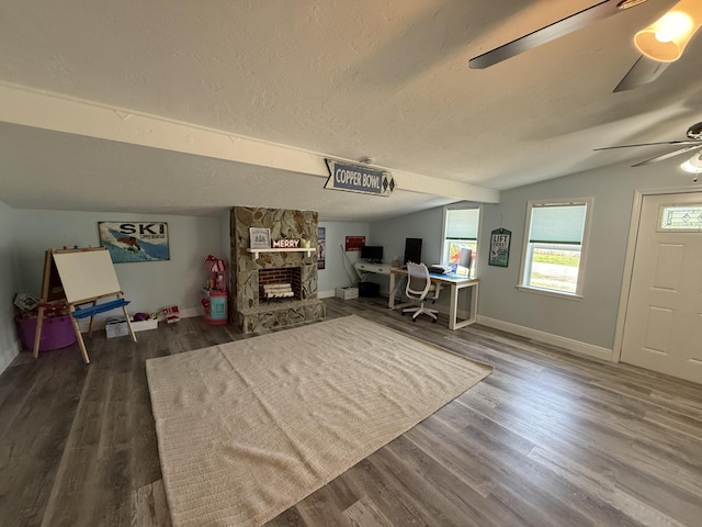 408 S 9th St, Lantana, FL 33462 - living room with ceiling fan, a desk, dark wood-type flooring, baseboards, and a textured ceiling