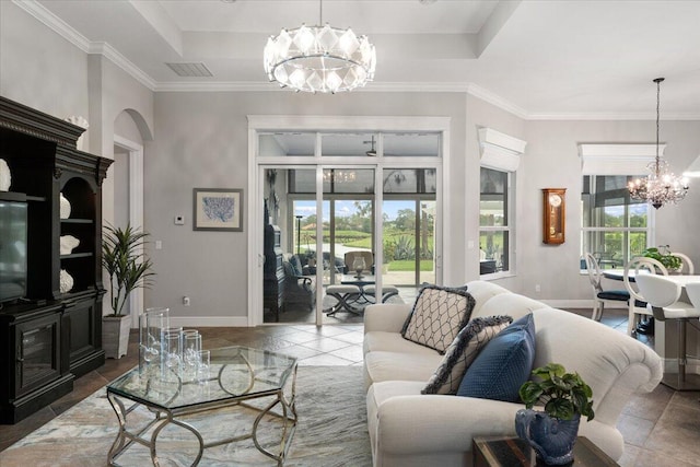 9926 SW Nuova Way, Port Saint Lucie, FL 34986 - living area featuring a chandelier, baseboards, arched walkways, tile patterned flooring, and crown molding