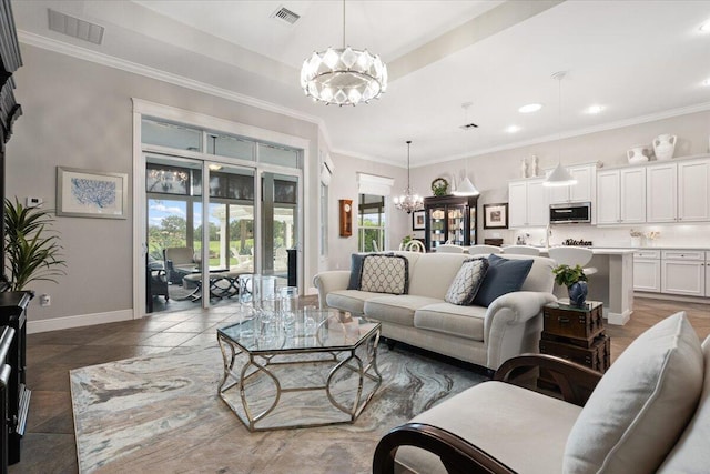 9926 SW Nuova Way, Port Saint Lucie, FL 34986 - living area featuring a chandelier, baseboards, recessed lighting, and ornamental molding