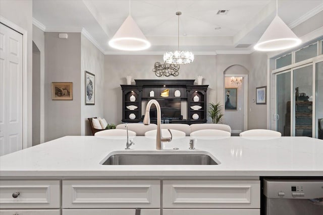 9926 SW Nuova Way, Port Saint Lucie, FL 34986 - kitchen featuring stainless steel dishwasher, a sink, open floor plan, white cabinets, and a chandelier