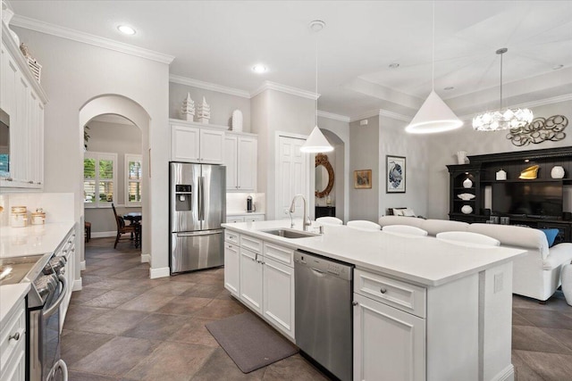 9926 SW Nuova Way, Port Saint Lucie, FL 34986 - kitchen with appliances with stainless steel finishes, arched walkways, a sink, white cabinetry, and recessed lighting