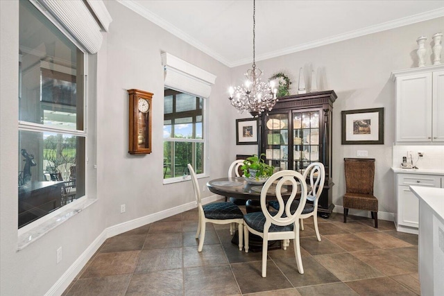 9926 SW Nuova Way, Port Saint Lucie, FL 34986 - dining area with a chandelier, ornamental molding, baseboards, and dark stone finish floors