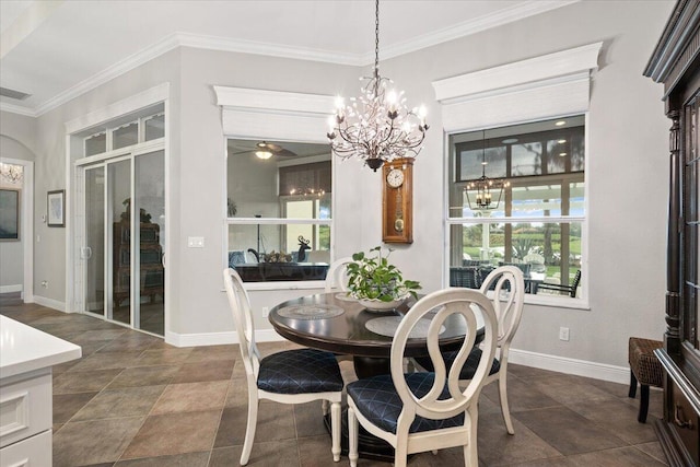 9926 SW Nuova Way, Port Saint Lucie, FL 34986 - dining area with a chandelier, crown molding, baseboards, and plenty of natural light
