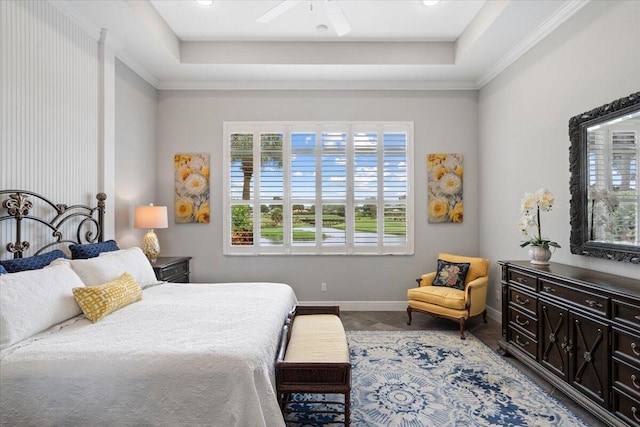 9926 SW Nuova Way, Port Saint Lucie, FL 34986 - bedroom with a raised ceiling, baseboards, and ceiling fan