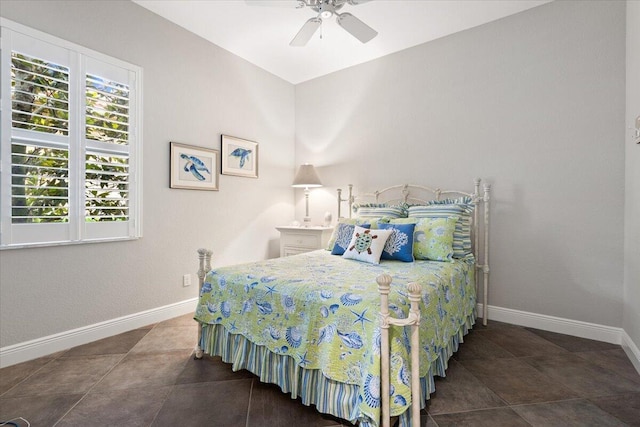 9926 SW Nuova Way, Port Saint Lucie, FL 34986 - tiled bedroom with baseboards and a ceiling fan