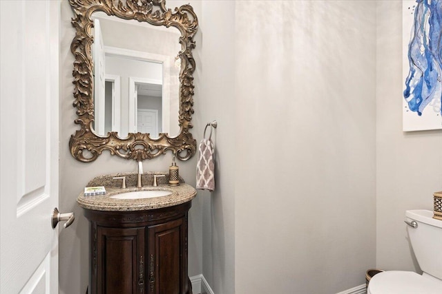 9926 SW Nuova Way, Port Saint Lucie, FL 34986 - half bath featuring toilet, vanity, and baseboards