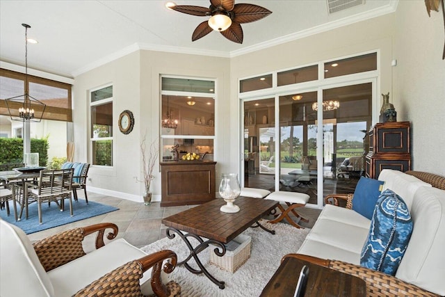 9926 SW Nuova Way, Port Saint Lucie, FL 34986 - living room featuring a chandelier, ceiling fan, baseboards, and ornamental molding
