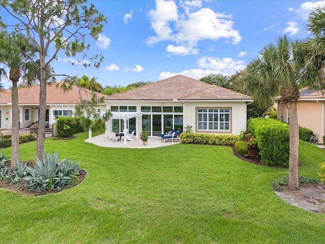 9926 SW Nuova Way, Port Saint Lucie, FL 34986 - back of house with a patio, stucco siding, a yard, and a tile roof