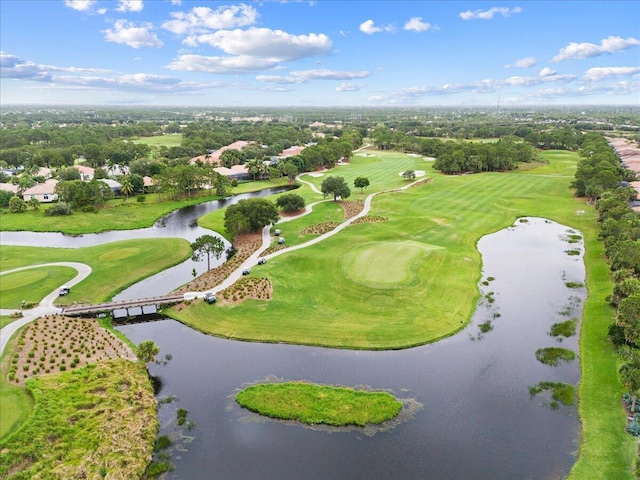 9926 SW Nuova Way, Port Saint Lucie, FL 34986 - drone / aerial view of a local golf course, a nearby body of water, and a tree filled landscape