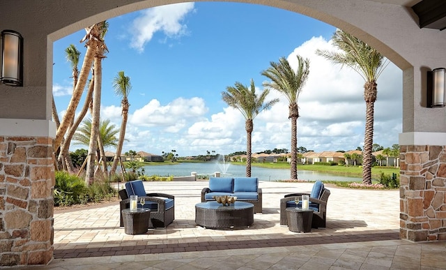 9926 SW Nuova Way, Port Saint Lucie, FL 34986 - view of patio with a water view, an outdoor hangout area, and a residential view