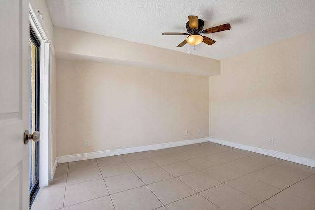 973 Springdale Cir Unit 97-C, Palm Springs, FL 33461 - unfurnished room with a textured ceiling, a ceiling fan, light tile patterned floors, and baseboards