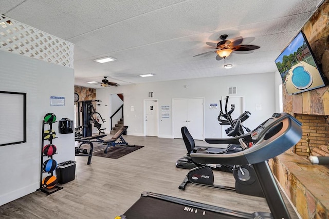 973 Springdale Cir Unit 97-C, Palm Springs, FL 33461 - gym with a ceiling fan, wood finished floors, and baseboards