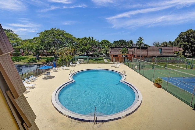973 Springdale Cir Unit 97-C, Palm Springs, FL 33461 - community pool featuring a patio