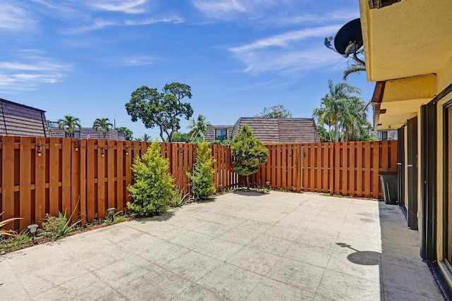 973 Springdale Cir Unit 97-C, Palm Springs, FL 33461 - fenced backyard featuring a patio area