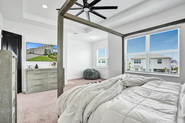 5609 Zestar Ln, The Acreage, FL 33470 - bedroom featuring carpet floors, a tray ceiling, baseboards, ceiling fan, and recessed lighting