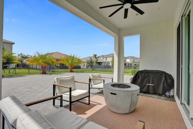 5609 Zestar Ln, The Acreage, FL 33470 - view of patio / terrace featuring a ceiling fan, a residential view, and an outdoor living space with a fire pit