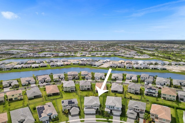 5609 Zestar Ln, The Acreage, FL 33470 - aerial perspective of suburban area featuring a nearby body of water