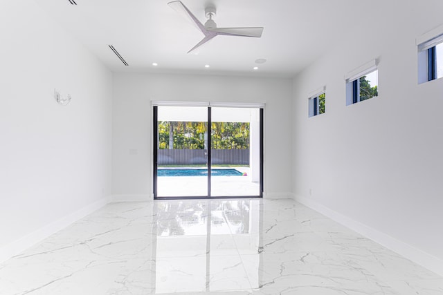 640 Marshall Rd, West Palm Beach, FL 33413 - spare room featuring marble tiled flooring, healthy amount of natural light, recessed lighting, a ceiling fan, and baseboards