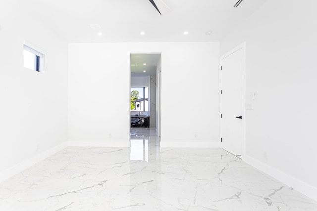 640 Marshall Rd, West Palm Beach, FL 33413 - unfurnished room featuring light marble finish floors, baseboards, and recessed lighting