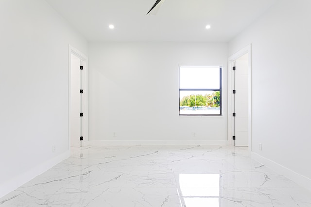 640 Marshall Rd, West Palm Beach, FL 33413 - unfurnished room with recessed lighting, light marble finish flooring, and baseboards