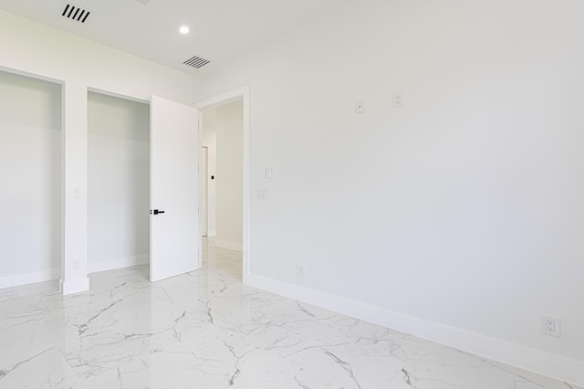 640 Marshall Rd, West Palm Beach, FL 33413 - unfurnished bedroom featuring light marble finish floors, baseboards, and recessed lighting