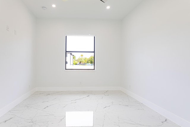640 Marshall Rd, West Palm Beach, FL 33413 - empty room with baseboards, recessed lighting, a smoke detector, and light marble finish flooring