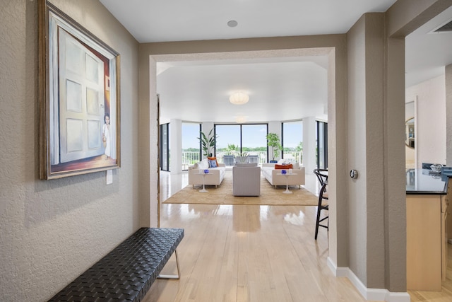 20310 Fairway Oaks Dr Unit 161, Boca Raton, FL 33434 - hallway with a textured wall and light wood-style floors