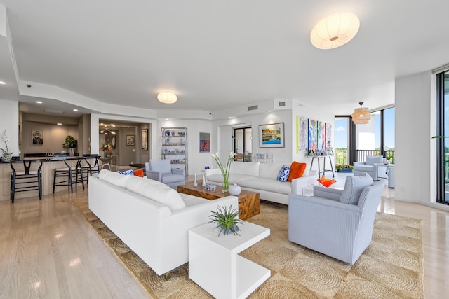 20310 Fairway Oaks Dr Unit 161, Boca Raton, FL 33434 - living room featuring a wall of windows and light wood-style floors