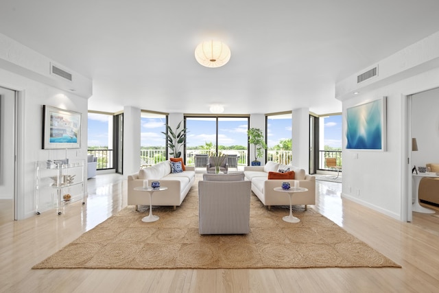 20310 Fairway Oaks Dr Unit 161, Boca Raton, FL 33434 - living room with a wall of windows and wood finished floors