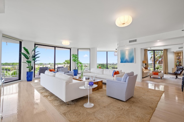 20310 Fairway Oaks Dr Unit 161, Boca Raton, FL 33434 - living room featuring wood finished floors and healthy amount of natural light