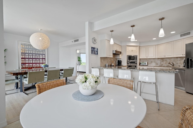 20310 Fairway Oaks Dr Unit 161, Boca Raton, FL 33434 - dining area with light tile patterned floors and recessed lighting