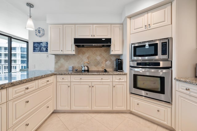 20310 Fairway Oaks Dr Unit 161, Boca Raton, FL 33434 - kitchen featuring appliances with stainless steel finishes, tasteful backsplash, light tile patterned floors, under cabinet range hood, and light stone counters