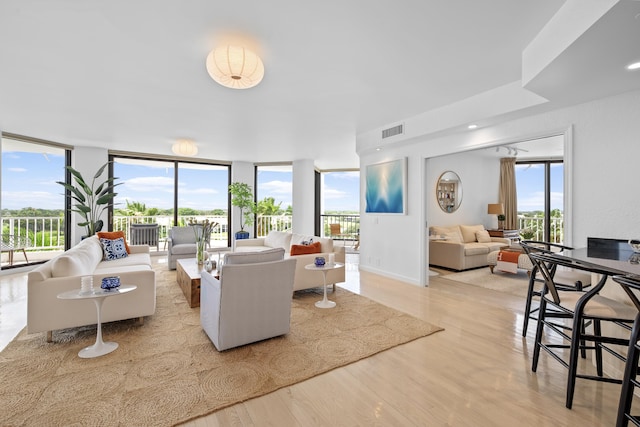 20310 Fairway Oaks Dr Unit 161, Boca Raton, FL 33434 - living room with light wood-type flooring and expansive windows