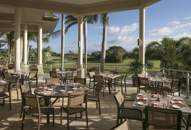 20310 Fairway Oaks Dr Unit 161, Boca Raton, FL 33434 - view of patio featuring outdoor dining space, golf course view, and a water view
