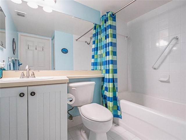 1590 S 42nd Cir Unit 106, Vero Beach, FL 32967 - bathroom featuring toilet, shower / tub combo with curtain, tile patterned flooring, and vanity
