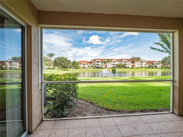 1590 S 42nd Cir Unit 106, Vero Beach, FL 32967 - unfurnished sunroom with a water view and a residential view