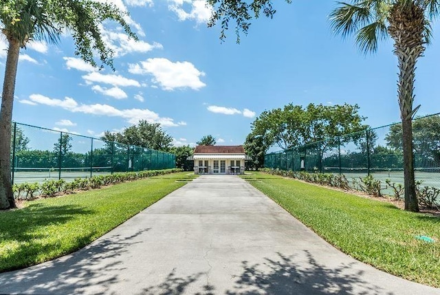 1590 S 42nd Cir Unit 106, Vero Beach, FL 32967 - view of home's community featuring a tennis court