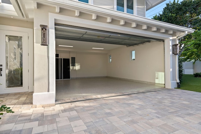 18119 SE Federal Hwy, Tequesta, FL 33469 - garage featuring decorative driveway